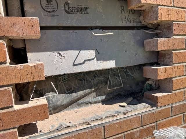 Opened masonry showing a corroded shelf angle